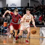 Murphysboro's Myles drives past Woodlawn senior Baylor Rollie. Photo by Hunter Whitecotton/Southern Focus Photography