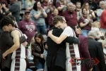 Benton head coach Ron Winemiller hugs senior Nolan Schafer after he checked out of the game for the final time of his high school career. Photo by Byron Hetzler
