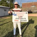 Crab Orchard's Fisher Watts poses with a millstone achievement sign of 100 Ks this season. Photo by Hunter Whitecotton/Southern Focus Photography