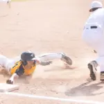 Goreville junior Nick King slides to avoid a tag by Crab Orchard's Gavin Shaw at 3rd on a steal attempt. Photo by Hunter Whitecotton/Southern Focus Photography