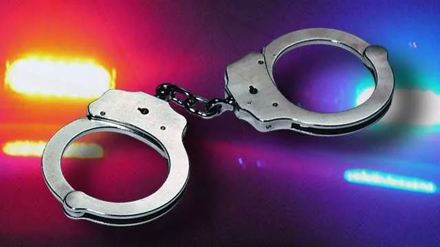 34653134-arrest-handcuffs-police-lights-widescreen889273