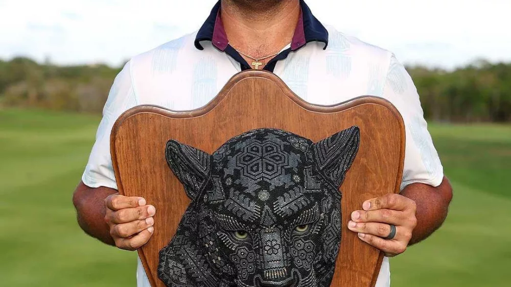 bryson-nimmer-holds-the-tulum-championship-trophy-after-picking-up-his-first-victory-on-the-korn-ferry-tour-68180e1fd9d77262331