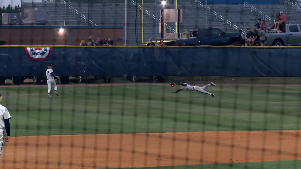 effingham-county-center-fielder-q-king-makes-a-diving-grab-against-river-ridge-in-the-ghsa-aaaaa-quarterfinals-681c21205fce2544462