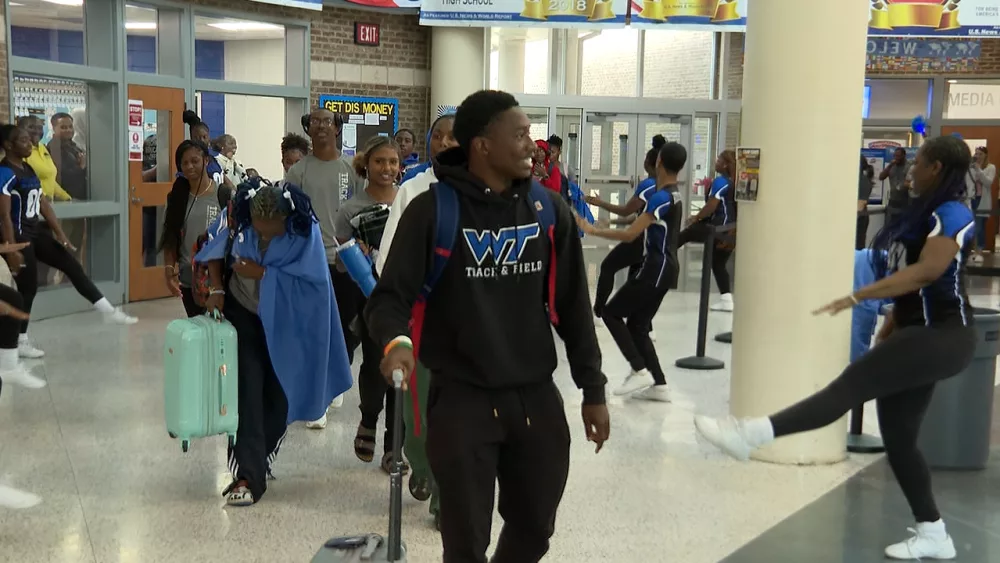 the-woodville-tompkins-track-team-walks-through-a-surprise-send-off-on-their-way-to-the-ghsa-state-championships-681d2abc9d17b628886
