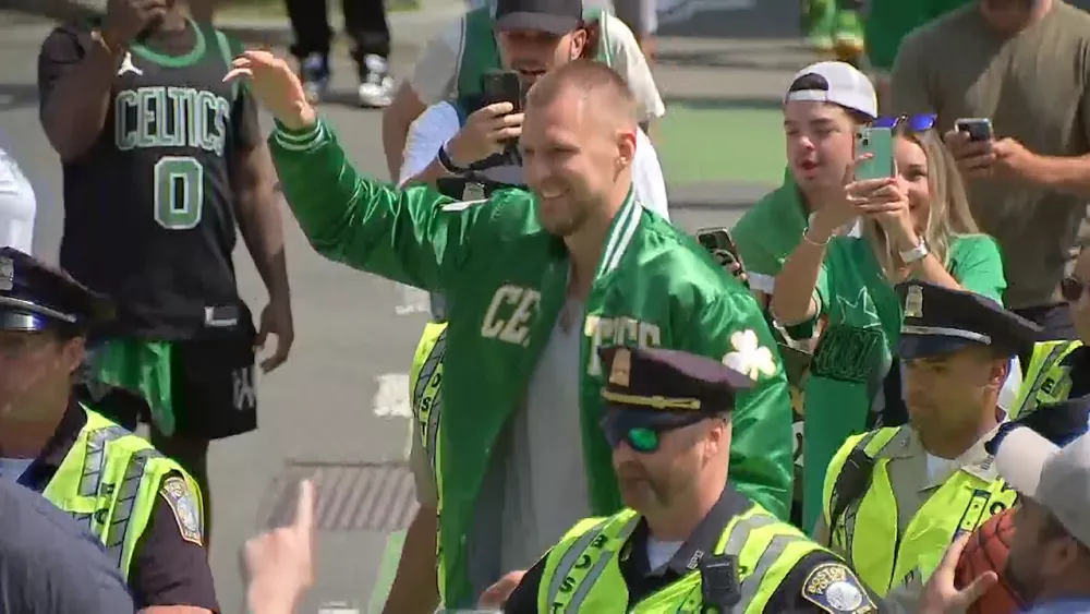 kristaps-porzingis-waves-to-boston-celtics-fans-during-the-2024-championship-parade-685b670687241282843