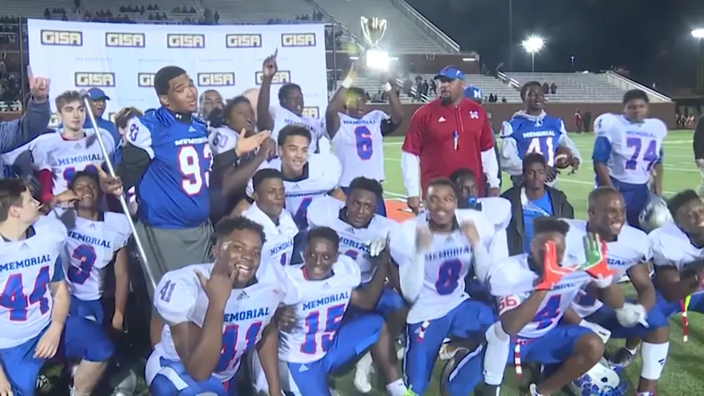 memorial-day-football-poses-after-winning-the-2017-gisa-state-championship-game-68796a224584f387384