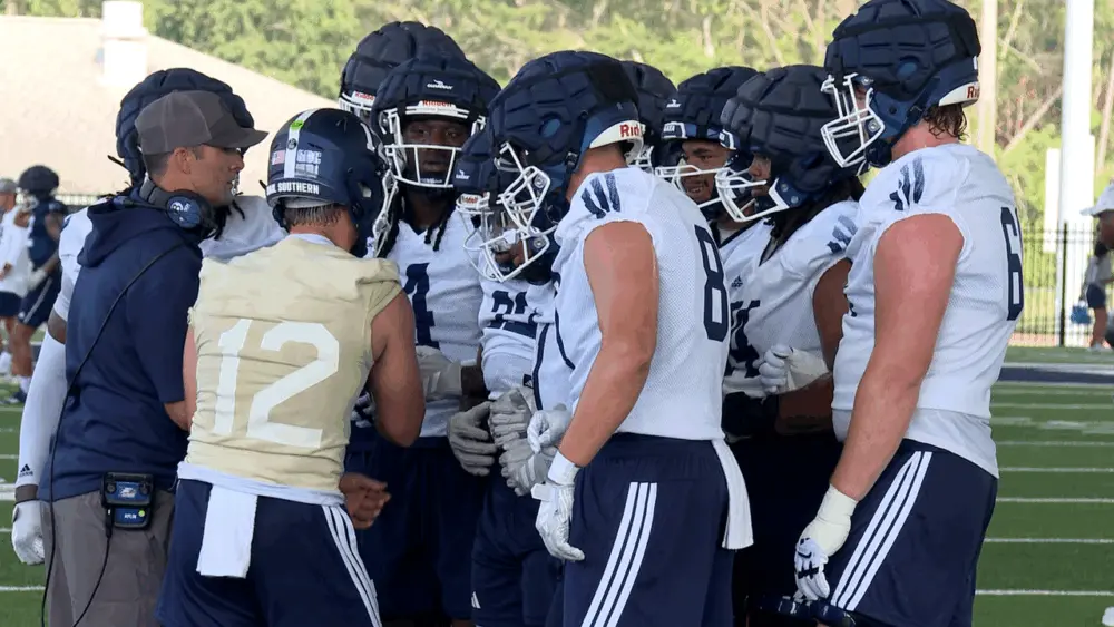georgia-southern-offensive-coordinator-ryan-aplin-and-quarterback-jc-french-lead-a-huddle-on-the-first-day-of-fall-cmap-688a8c582d4ee130880