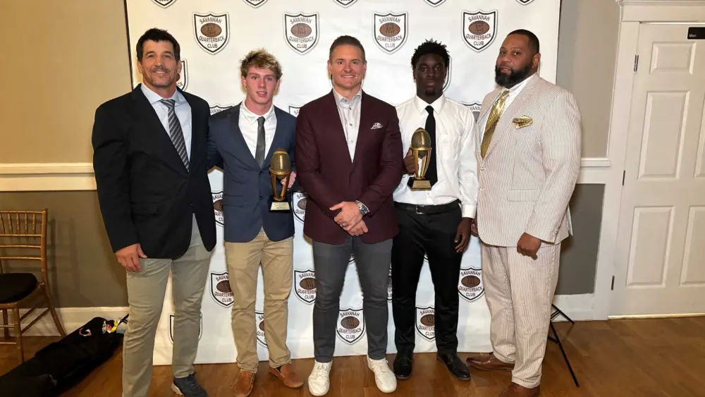 savannah-christian-linebacker-john-gross-and-beach-running-back-jordan-newton-alongside-their-coaches-and-dusty-dvoracek-honored-at-the-savannah-quarterback-club-6909750539c7c263506