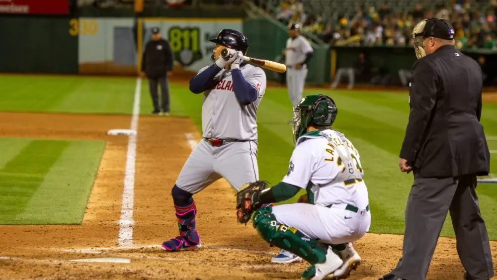 Oakland^ California - March 28^ 2024: Cleveland Guardians first baseman Josh Naylor bats against the Oakland Athletics on Opening Day at the Oakland Coliseum.
