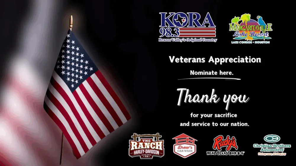 A slider graphic for the KORA Veterans Promotion. A US flag is blurred in the background with a smaller US flag in front of it. There are also sponsor logos for this event.