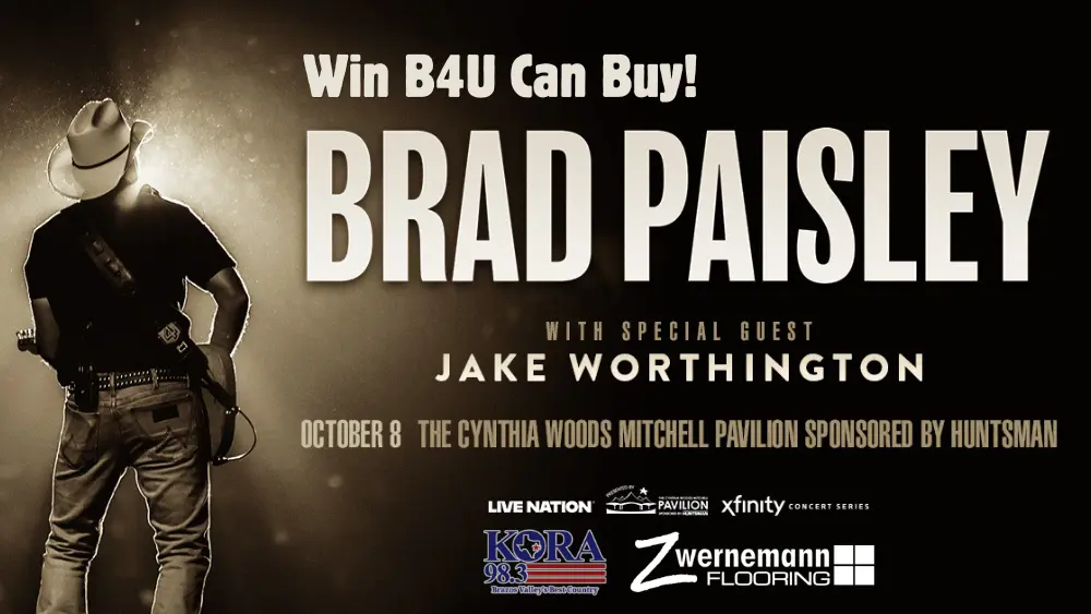 The slider graphic for the Brad Paisley Win B4U Can Buy Ticket Giveaway. Braid Paisley is shown playing a guitar under a bright light.