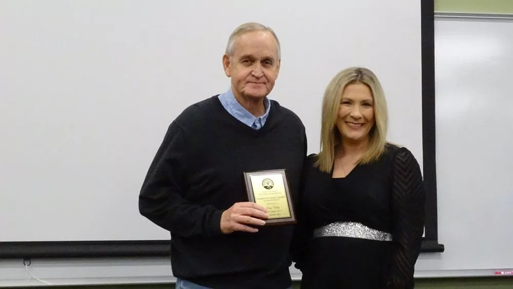 Larry Curling, recipient of the Community Impact Award for Caldwell County, and Ashley Alexander, executive director of the United Way of the Coalfield