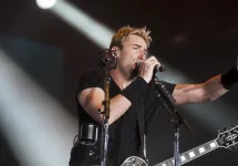 Chad Kroeger^ lead vocalist of the Canadian band Nickelback^ performs during the Rock in Rio 2013 concert^ on September 20^ 2013 in Rio de Janeiro^ Brazil.