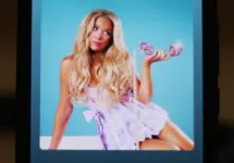 Image shows the album cover and Spotify playback screen displayed on a phone for the song "6 Months Later" by country music artist Megan Moroney.