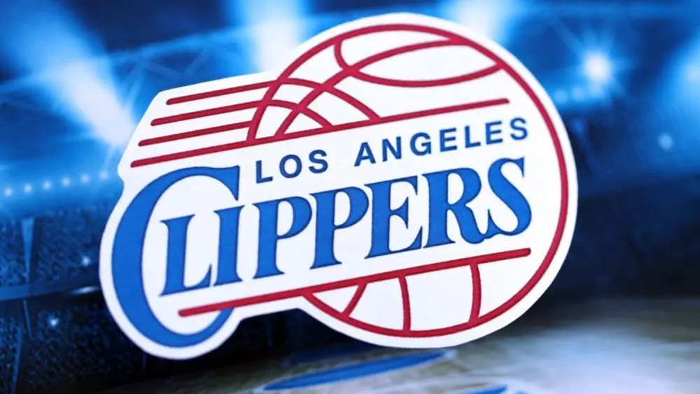 Los Angeles Clippers basketball team badge lies on basketball stadium background banner