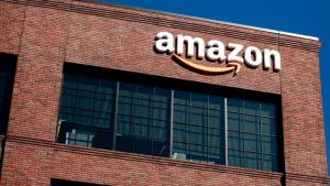 Closeup of Amazon logo on the company office building in East Palo Alto^ Silicon Valley^ San Francisco Bay Area. Amazon sign on brick building wall East Palo Alto^ California US - October 17^ 2024