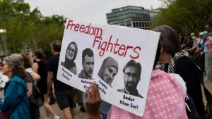 Demonstrators gather during a protest in front of the White House in Washington^ DC^ on April 19^ 2025.