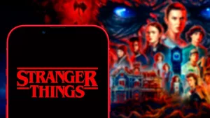 Computer keyboard with the Iphone 11 pro with the Stranger Things logo.
