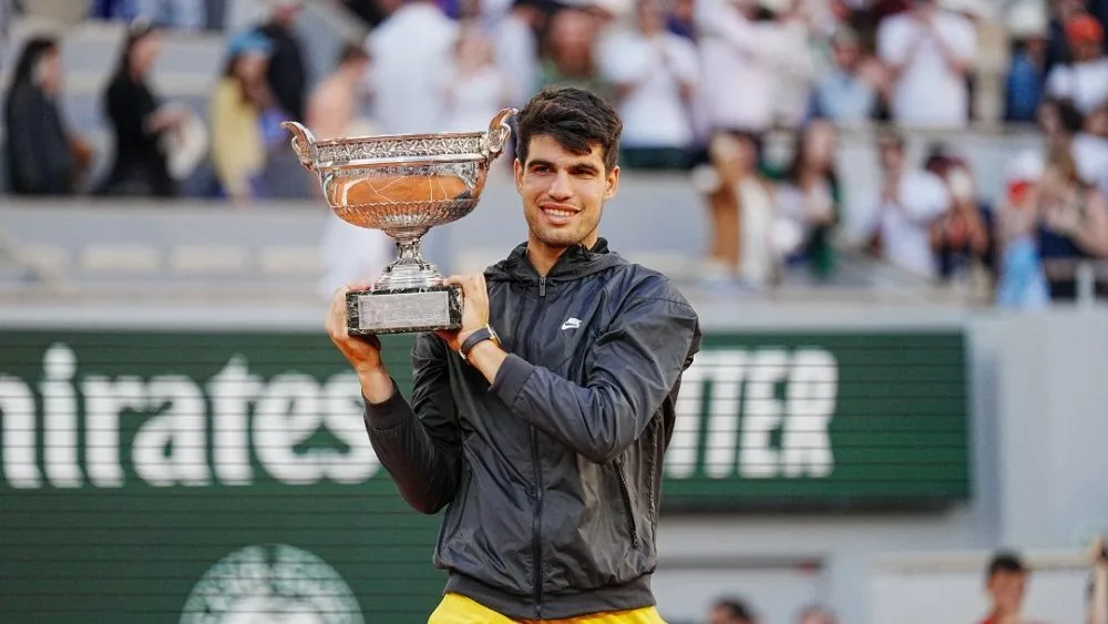 Roland Garros champion Carlos Alcaraz of Spain during trophy presentation after men's final match victory against Alexander Zverev of Germany in Paris^ France. PARIS^ FRANCE - JUNE 9^ 2024