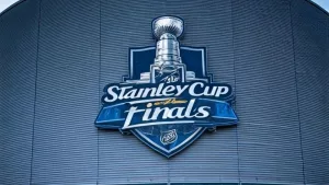 the front facade of a hockey arena with the NHL Stanley Cup Finals logo on the front of the building.