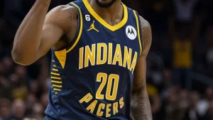 professional male nba basketball indiana pacers player^ screaming^ pointing finger up