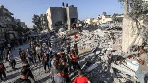 Palestinians evacuate wounded after an Israeli airstrike in Rafah refugee camp^ southern Gaza Strip^ on October 13 2023.