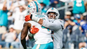 Miami Dolphins cornerbacks Kader Kohou (4) celebrates with Jalen Ramsey (5) after an interception against the Los Angeles Chargers during an NFL football game^ Sept. 10^ 2023^ in Inglewood^ Calif.