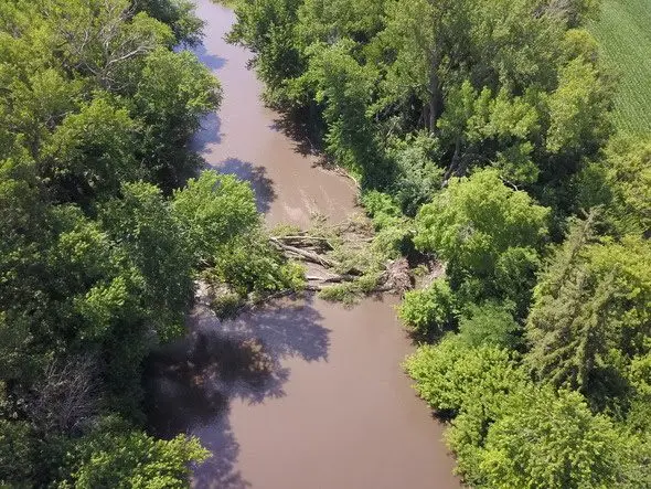rain-swollen-river-with-debris-in-iowa