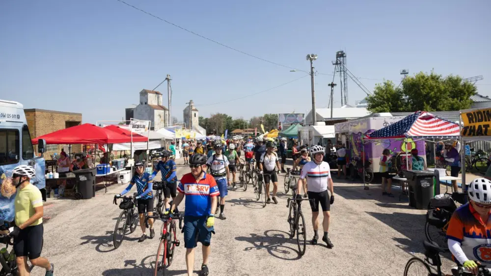 RAGBRAI cyclists arrive in Alexander, Iowa. (Photo: Iowa Soybean Association / Joclyn Kuboushek)