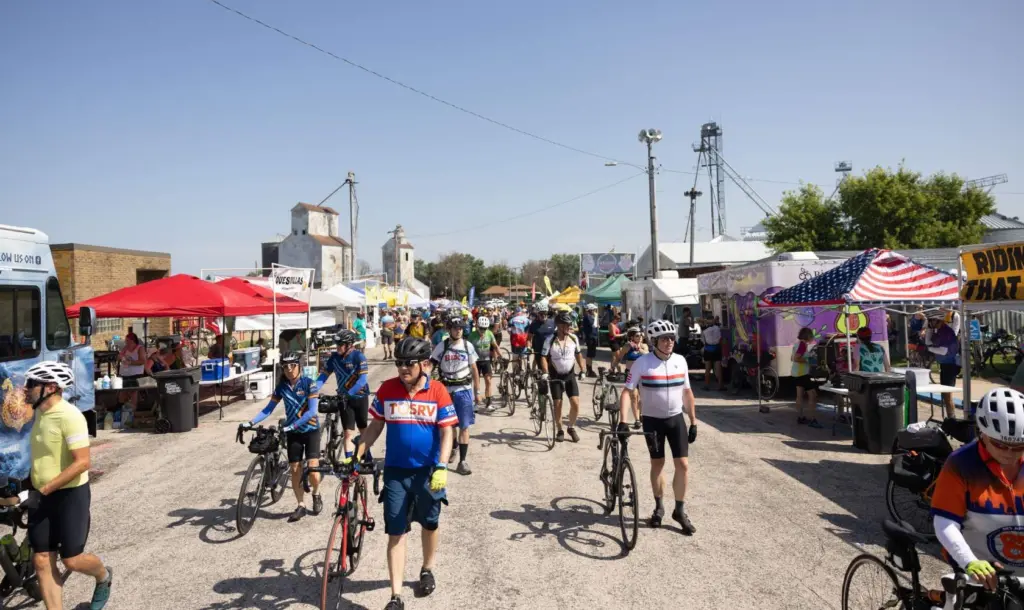 RAGBRAI cyclists arrive in Alexander, Iowa. (Photo: Iowa Soybean Association / Joclyn Kuboushek)