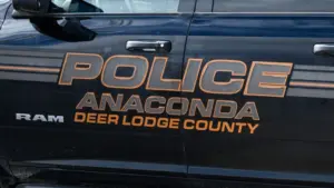 Sign on Anaconda Deer Lodge County police car in closeup. Anaconda^ MT^ USA - May 6^ 2025