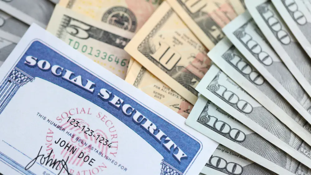 american-us-dollars-money-bills-and-us-social-security-number-card-close-up
