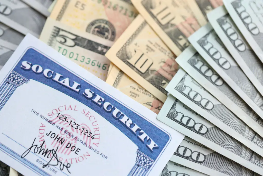 american-us-dollars-money-bills-and-us-social-security-number-card-close-up