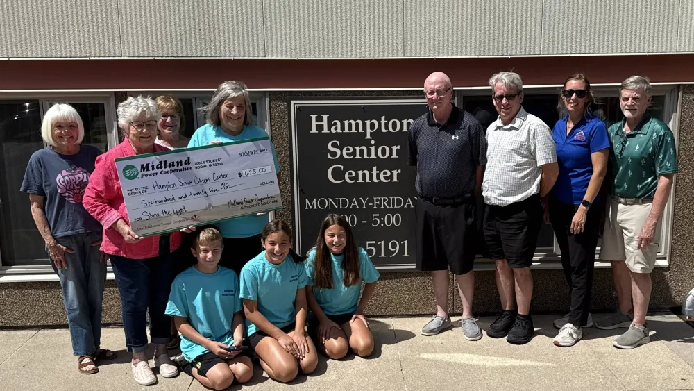 Hampton Senior Center staff and volunteers accept a donation from Midland Power Coop. Also in attendance were officials from the Chamber/Main Street Program.