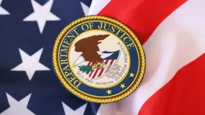 US Department of Justice seal on United States of America flag close up