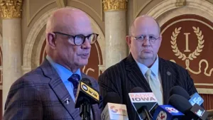 Republican Representative Steve Holt of Denison (on left) speaks during a statehouse news conference. (RI file photo)