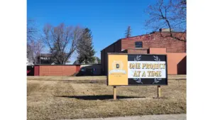 revitalize-dumont-sign-project-school-building