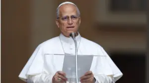 Pope Leo XIV recites the Angelus and imparts his blessing at the gates of the Apostolic Palace before thousands of faithful in Castelgandolfo. Castelgandolfo^ Italy - August 17^ 2025