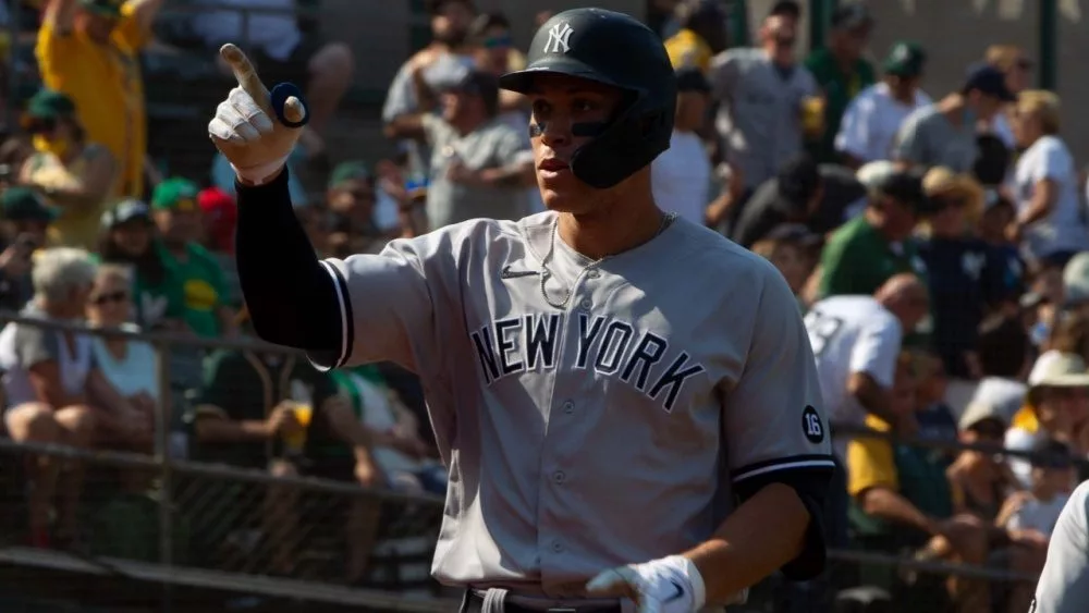 Aaron Judge #99 of the New York Yankees celebrates after hitting a home run against the Oakland Athletics at RingCentral Coliseum. Oakland^ California - August 28^ 2021