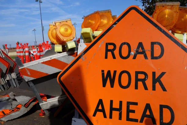 traffic-barricades-and-road-work-ahead-sign