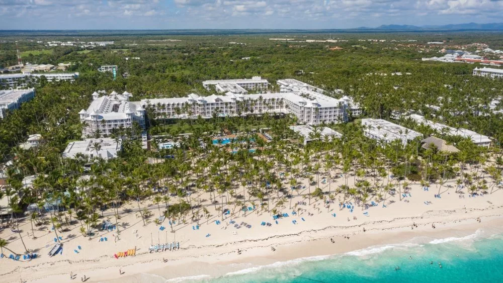 Aerial view from drone on RIU resort building on caribbean beach in Punta Cana^ Bavaro^ Dominican Republic - 8 April 2022