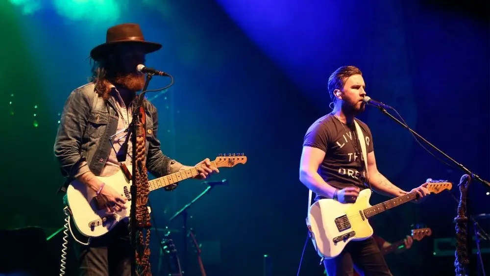 NEW YORK-MAY 6: Singers T.J. Osborne (R) and John Osborne of Brothers Osborne perform onstage at the Paramount on May 6^ 2016 in Huntington^ New York.