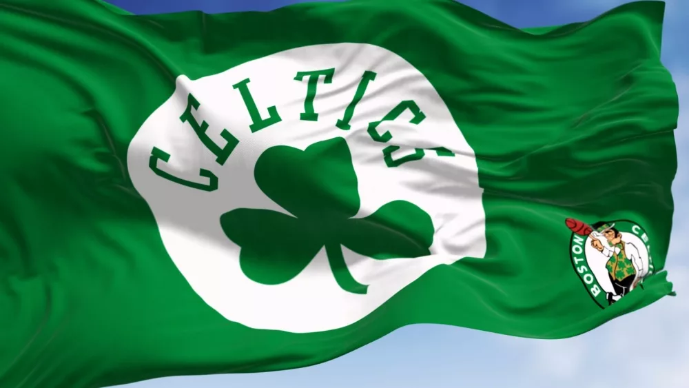 Boston Celtics flag waving in the wind on a clear day. American professional basketball team^ Eastern Conference Atlantic Division. Illustrative editorial 3d illustration render