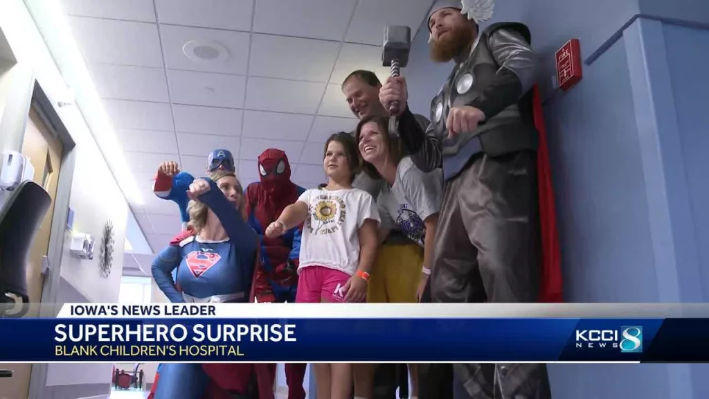 Caped crusaders clean windows, bring joy to kids at Iowa children's hospital