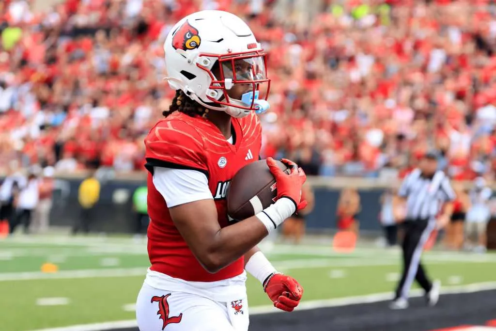 Louisville receiver catches 2 TD passes one year after heroic rescue