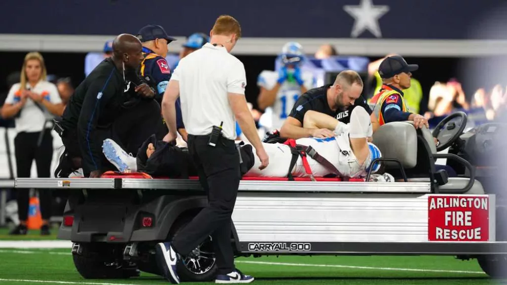 Detroit Lions star pass rusher Aidan Hutchinson carted off field with broken tibia