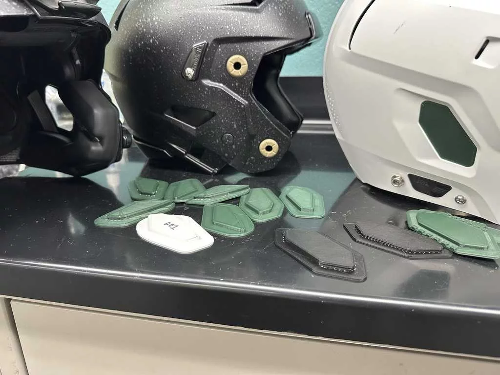 Michigan State engineering prof, student design helmet inserts to help drown out crowd noise for QBs