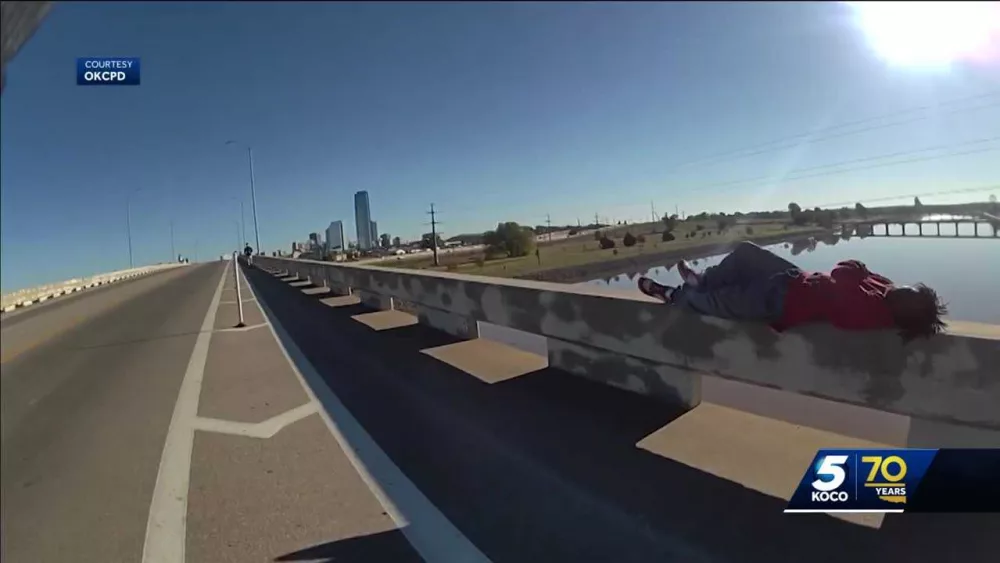 Body camera video shows Oklahoma City police officer, runner saving man from falling off bridge