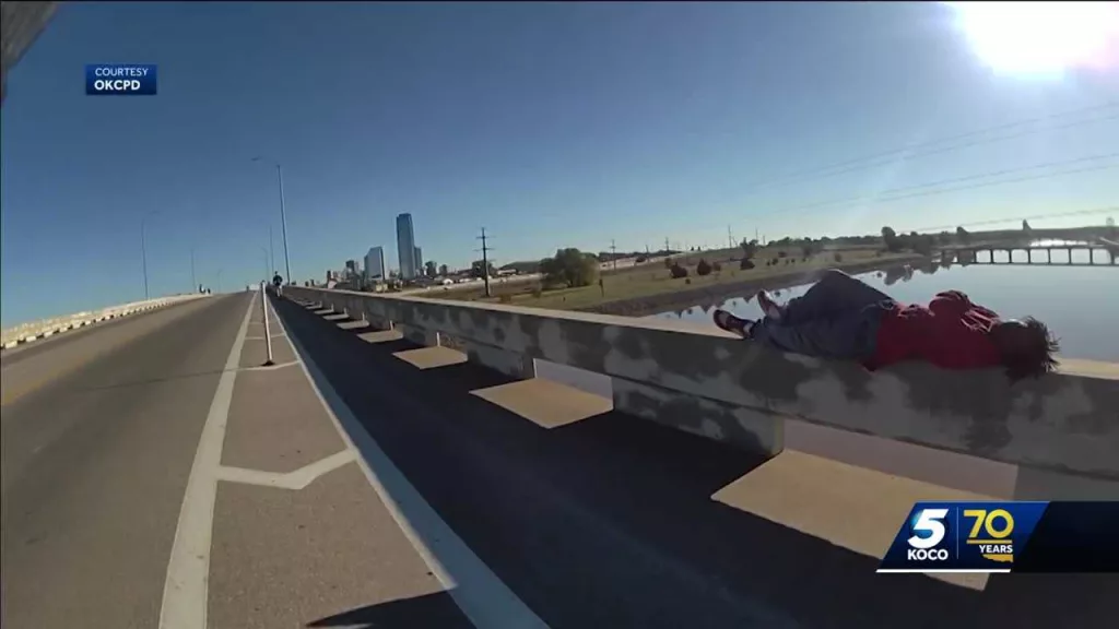 Body camera video shows Oklahoma City police officer, runner saving man from falling off bridge