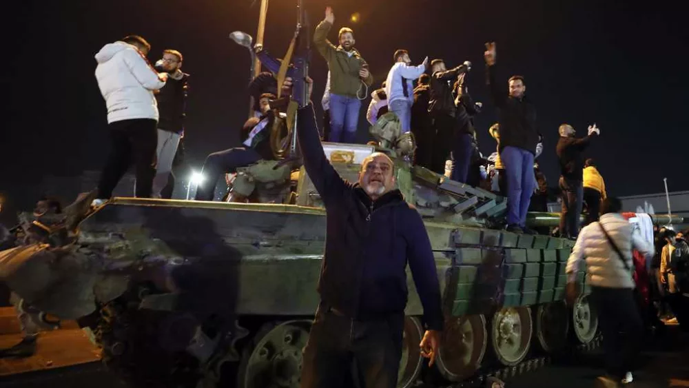 Syria latest: Syrians celebrate Bashar Assad's fall as his whereabouts remain unknown